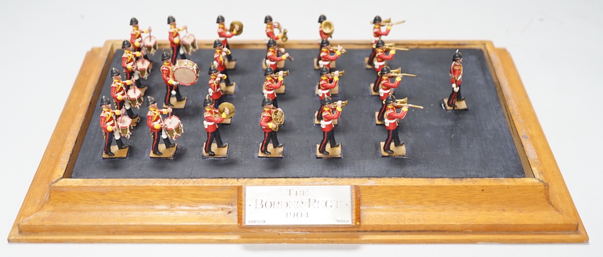 A group of painted lead soldiers, depicting the Border Regiment 1904